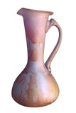  longdesc="Small Pink and Silver Shimmering Blown Glass Vase ~ The Hand on Hip ~ an eagle beak like tip at the rim for easy pouring of oils, water etc. Long neck , inflated round body, and handle stretches from upper section of rim and down to midsection 