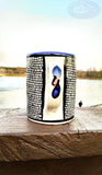 longdesc=" Large Mosaic Glazed Ceramic Mug that has two Red yellow Fishes and a blue and green basket containing round red and yellow pieces of bread loaves, which have been pattern pressed with a mosaic shape in black color. The almost square mosaic bord