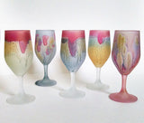6 Tulip shaped glass stemware Luster stained with 6 different Nouveau Reuven glass art styles ; color varieties of Ivory, Melon Pink, Baby Blue, Baby Pink and Light Steel like splashes and or rim on the coupe.